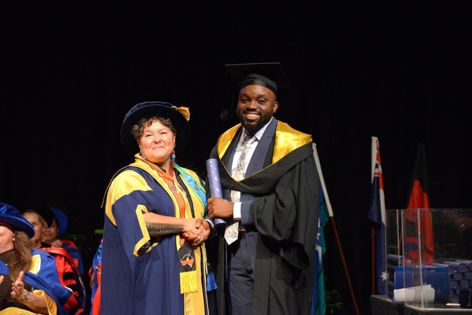 Graduation handshake at ceremony